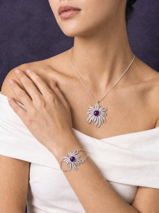 Crystal Fireworks necklace and bracelet styled against a violet background