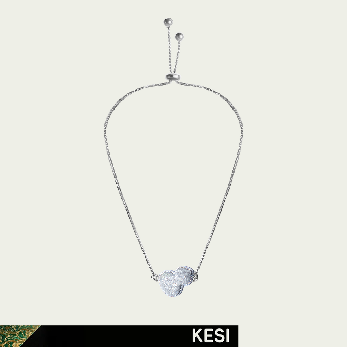 Beethoven’s Cool Moonlight: a white silk gourd motif on a silver-toned bracelet chain; product view.