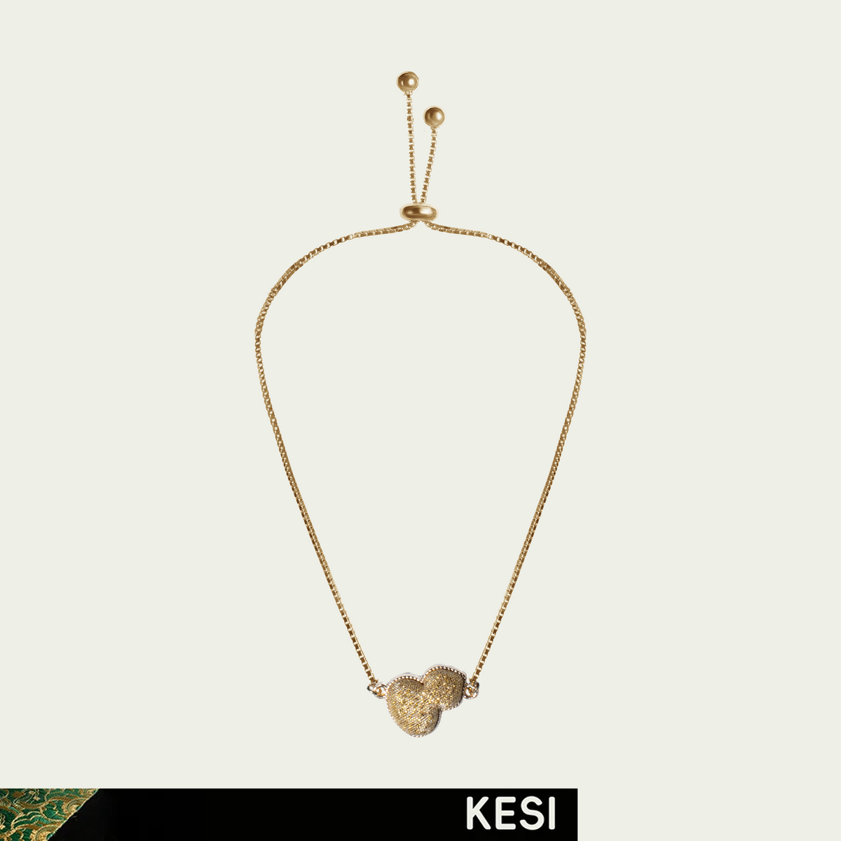 Klimt’s Golden Reverie: a gold silk gourd motif on a gold-toned bracelet chain; product view.
