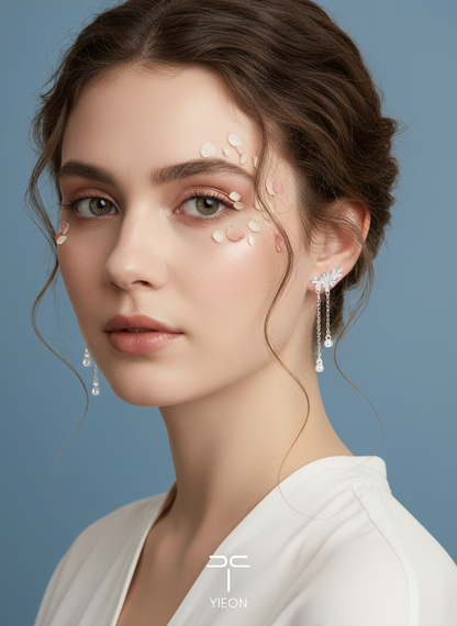Daisy filigree earrings shown on both ears.