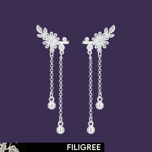 Daisy 999 fine silver filigree earrings with flower motifs and twin trailing chains.