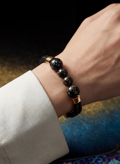 Midnight hand-painted lacquer bracelet worn on the wrist