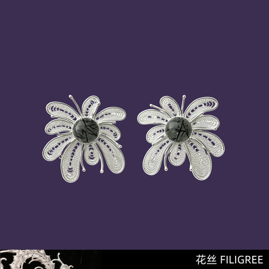 Pair of silver filigree firework earrings with black rutilated quartz centers