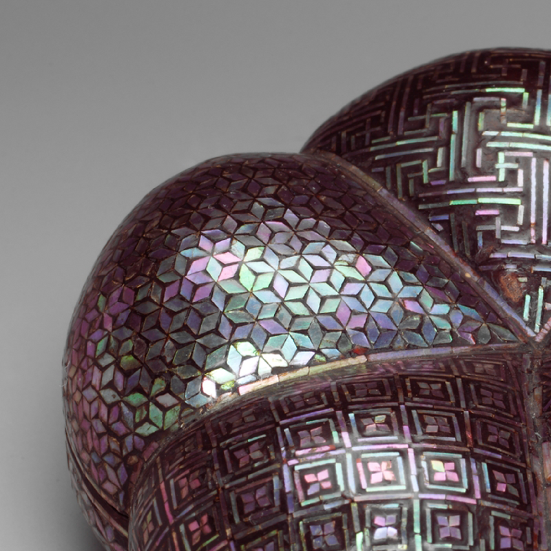 Close detail of mother-of-pearl inlay on a Korean lacquer box.