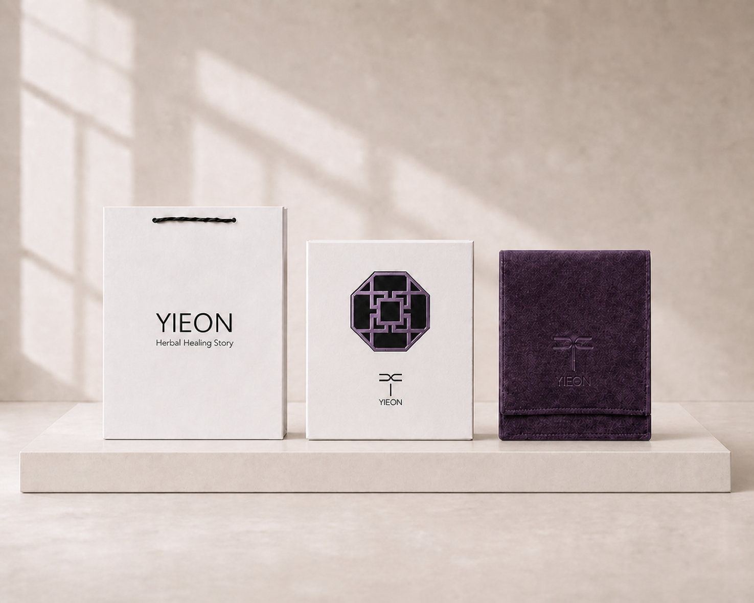 YIEON gift packaging with a branded bag, gift box, and ink-violet velvet pouch